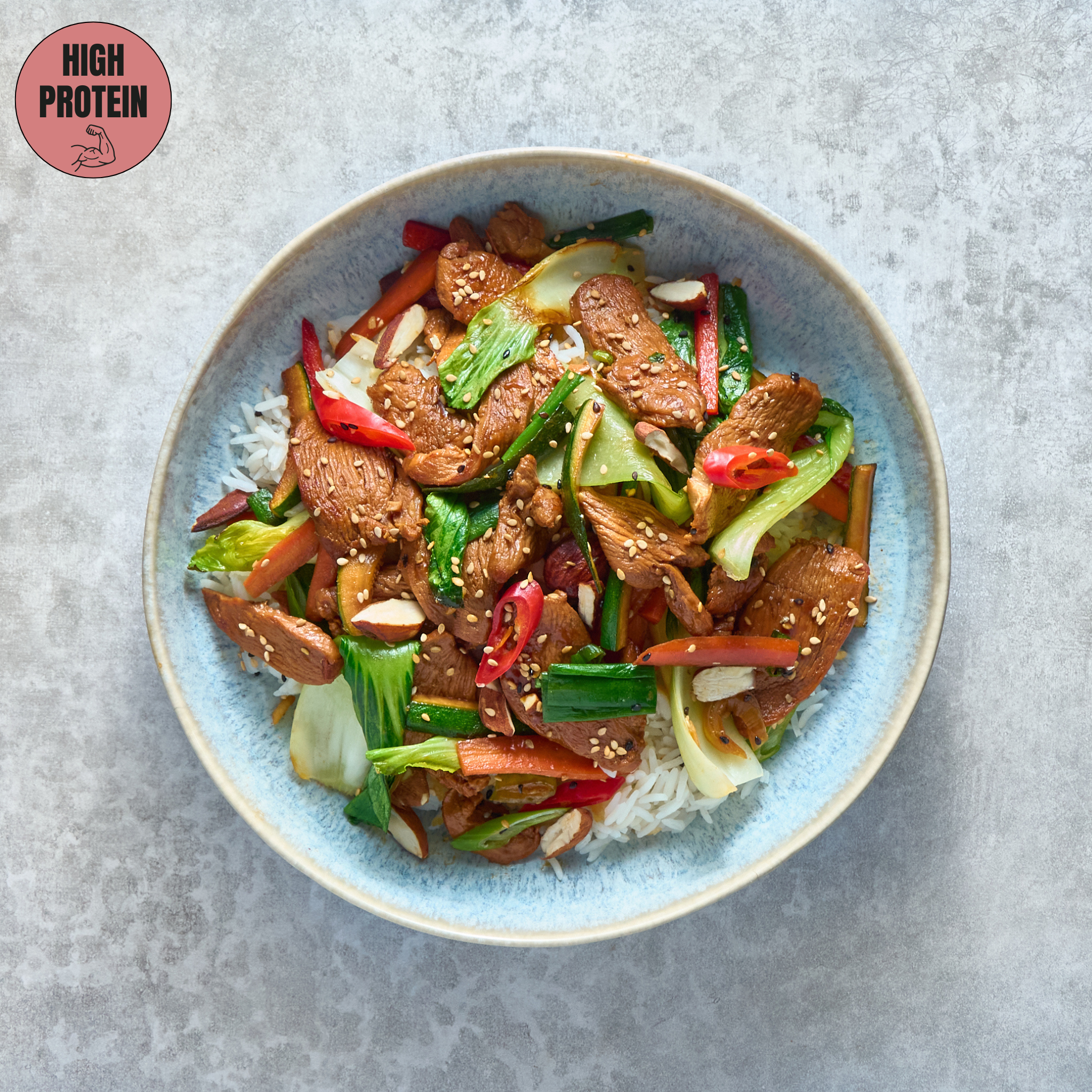 Soy Sauce Chicken Stir-Fry with Vegetables and Almonds, Served with Basmati Rice