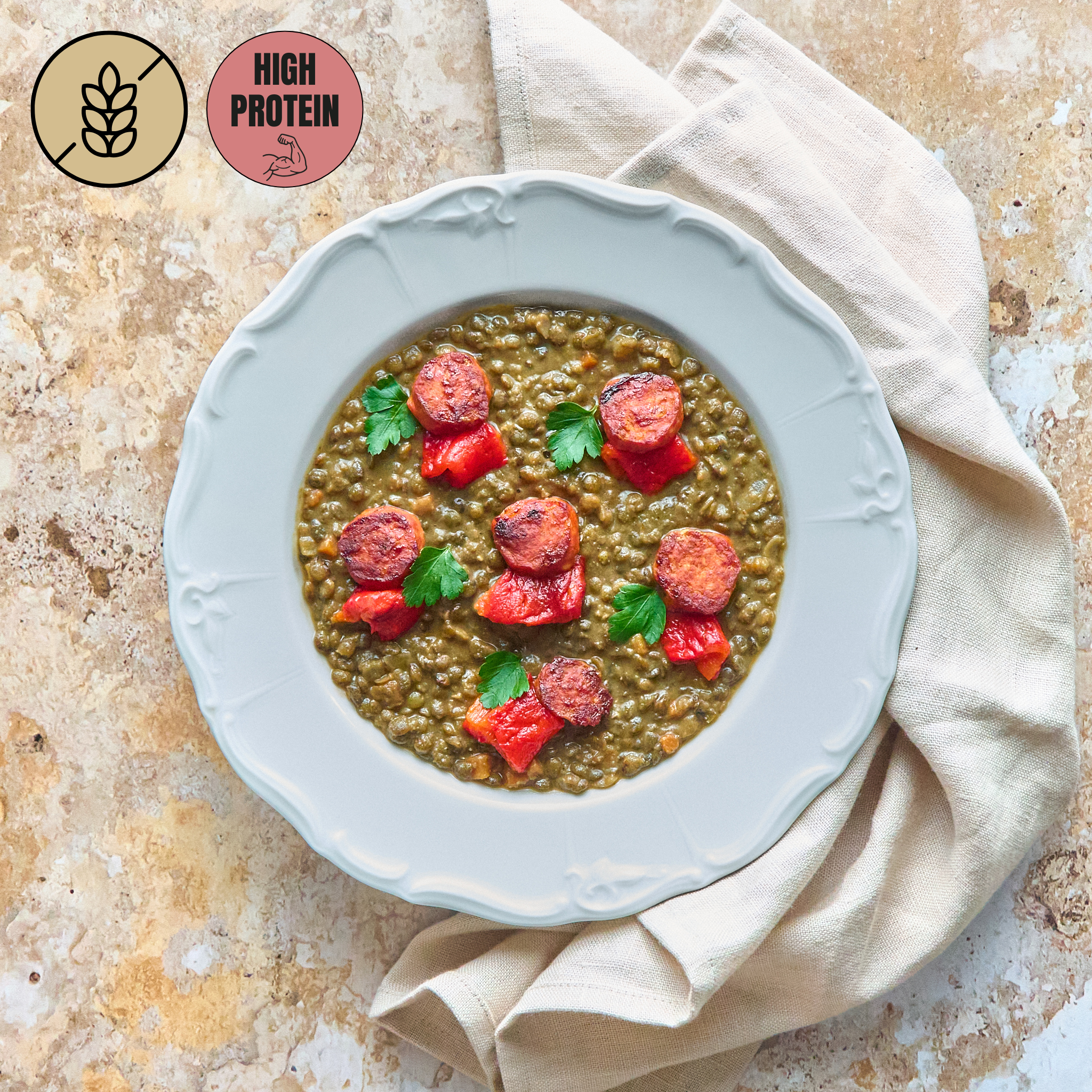 Linsen mit gegrillten Chorizo-Scheiben und kandierten Paprikas