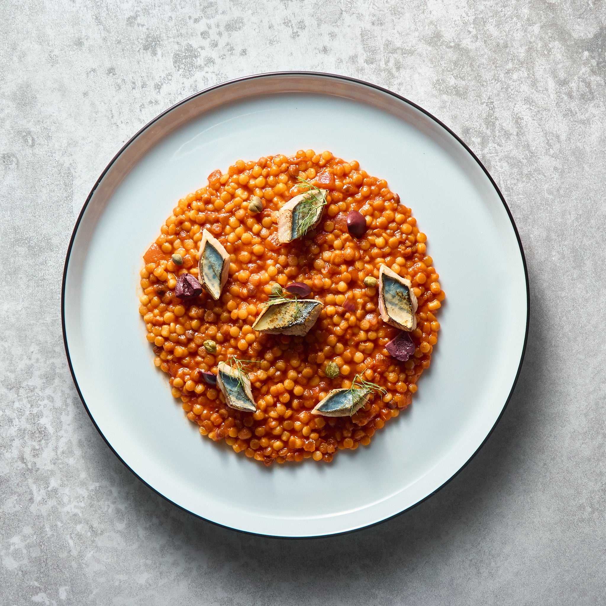 Puttanesca style Fregola Sarda with Grilled Mackerel