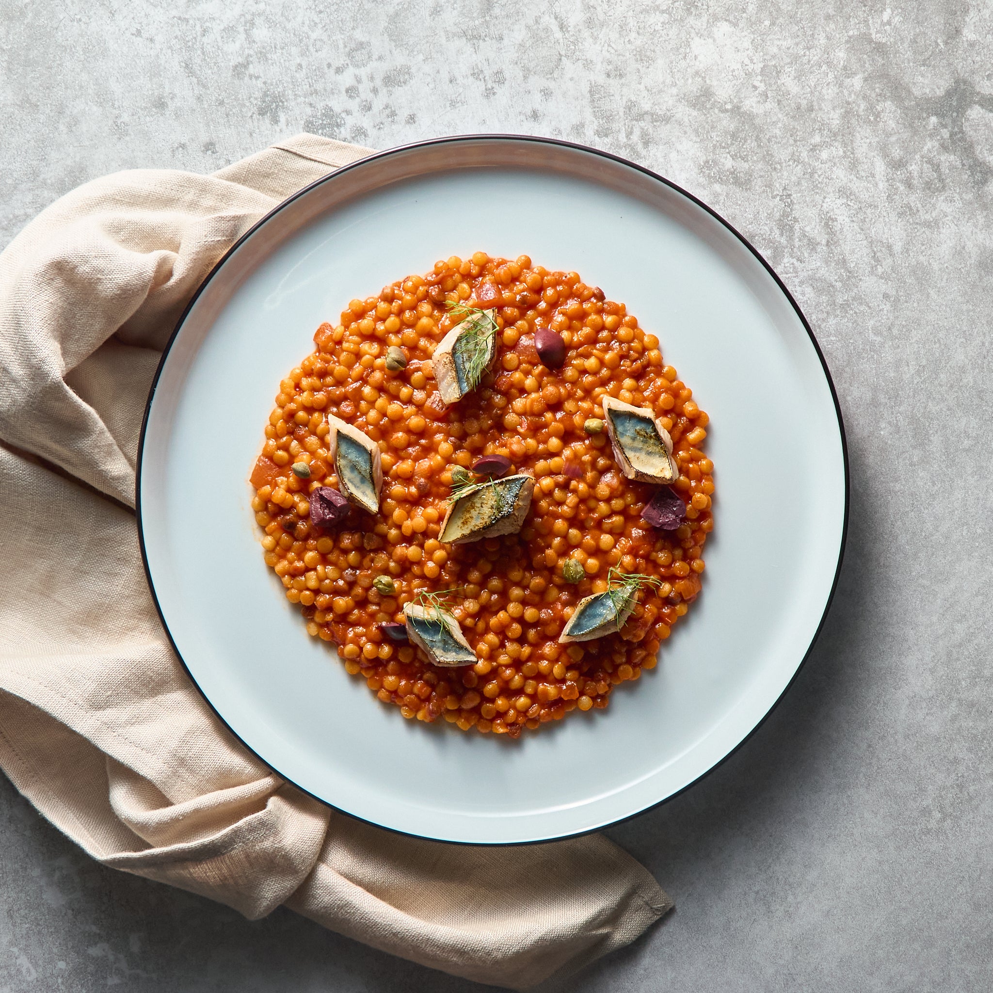 Puttanesca style Fregola Sarda with Grilled Mackerel